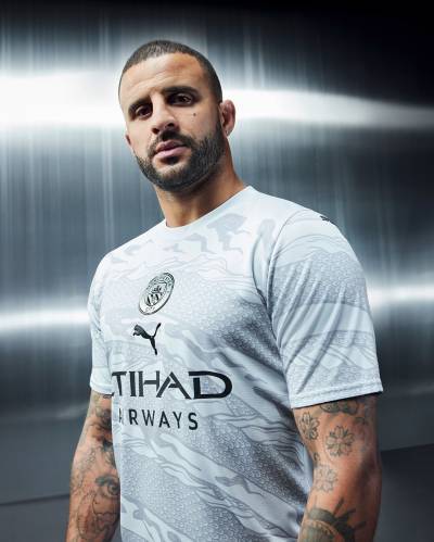 manchester_city_2024_puma_year_of_the_dragon_jersey_b.jpeg
