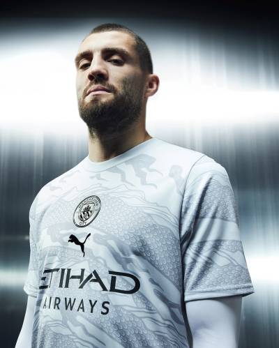 manchester_city_2024_puma_year_of_the_dragon_jersey_c.jpeg