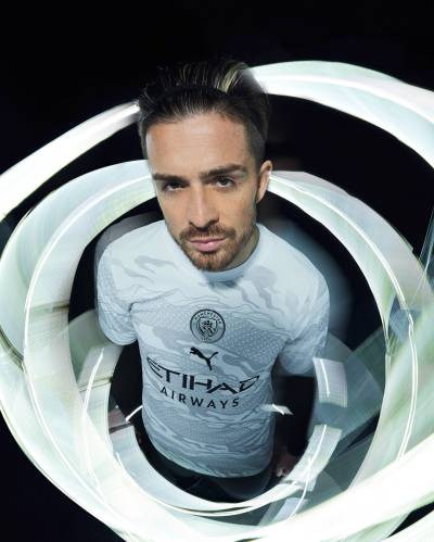 manchester_city_2024_puma_year_of_the_dragon_jersey_e.jpeg