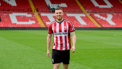 lincoln_city_2023_24_oxen_home_kit_g.jpeg