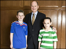 Old Firm sponsor Carling is to remove its logo from Rangers and Celtic children's football tops