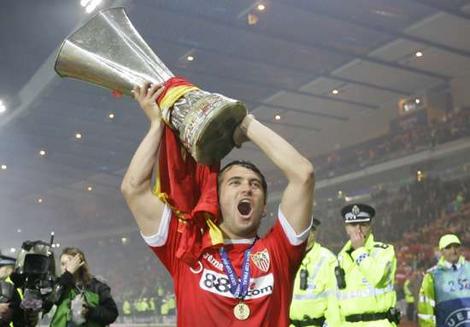 Sevilla's Aleksandr Kerzhakov celebrates with the trophy at the end of the UEFA Cup final in Glasgow. Sevilla's Aleksandr Kerzhakov celebrates with the trophy at the end of the UEFA Cup final in Glasgow.