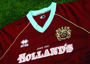 The new home shirt is predominantly claret, with blue trim. It features a retro V-neck in blue, with the sleeves also trimmed in blue and club embroidery on both sleeves The new home shirt is predominantly claret, with blue trim. It features a retro V-neck in blue, with the sleeves also trimmed in blue and club embroidery on both sleeves