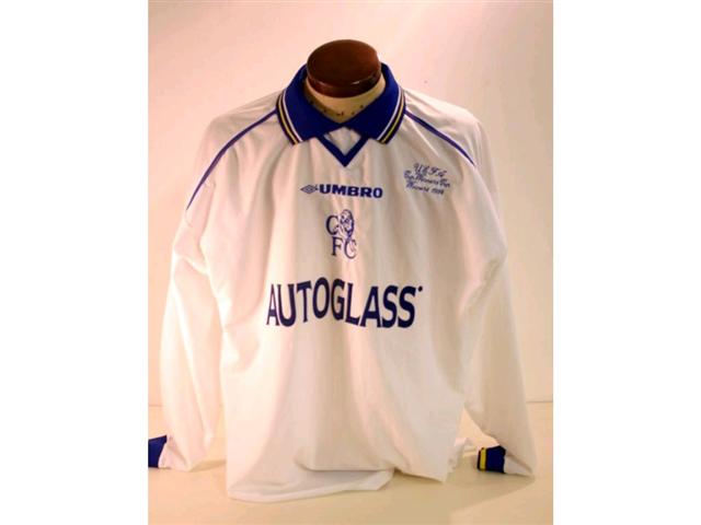 186. Shirt: A white with blue & yellow trim Chelsea Shirt with embroidered badge and “UEFA Cup Winners Cup Winners 1998” to front and No. 24 Newton to rear. £120-150 186. Shirt: A white with blue & yellow trim Chelsea Shirt with embroidered badge and “UEFA Cup Winners Cup Winners 1998” to front and No. 24 Newton to rear. £120-150