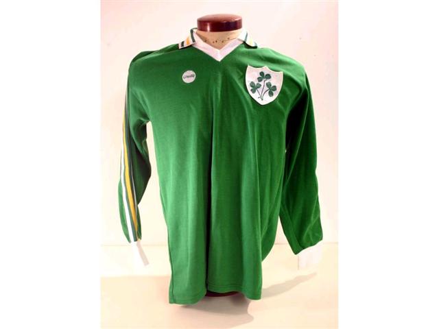 319. Republic of Ireland International Shirt: A green with white & yellow trim V-neck shirt with embroidered Shamrock badge to front, No. 15 to rear plus exchange gift from the match, itinerary and programme. £200-250 319. Republic of Ireland International Shirt: A green with white & yellow trim V-neck shirt with embroidered Shamrock badge to front, No. 15 to rear plus exchange gift from the match, itinerary and programme. £200-250