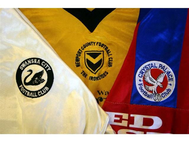 323. Shirts: An amber with black trim Newport County shirt, No. 13 to rear, a white with black trim Swansea City shirt, No. 11 to rear & a blue & red Crystal Palace shirt, No. 7 to rear. (3). &pound;75-100