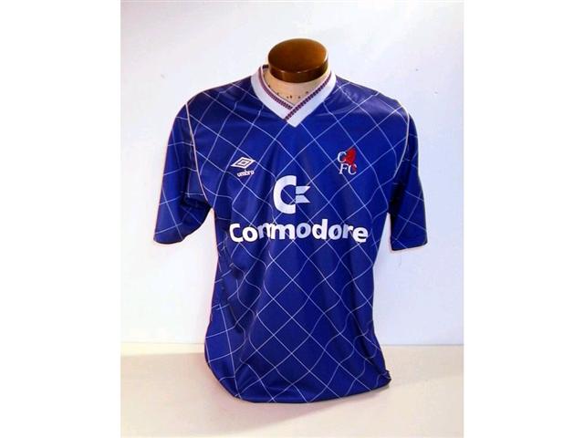 440. Players Shirt: A blue with white trim short sleeve Chelsea shirt with embroidered crest & sponsors &ldquo;Commodore&rdquo; to front No. 3 to rear. &pound;150-180