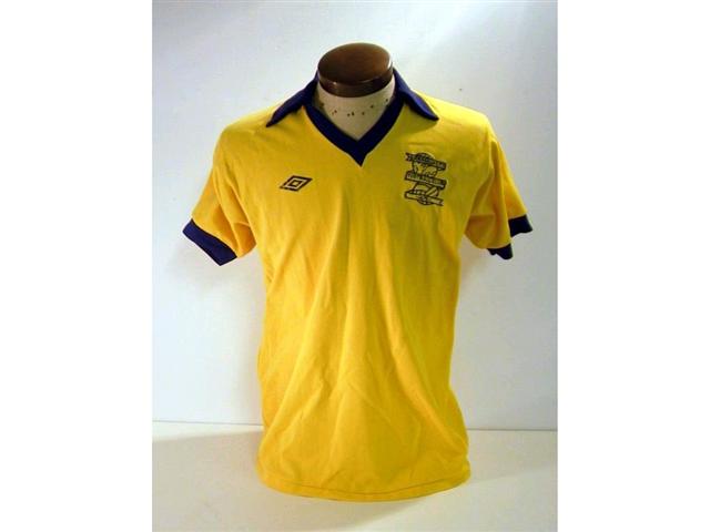 441. Players Shirt: A yellow with blue trim short sleeve Birmingham City shirt c1980 with embroidered crest to front, No. 11 to rear. £100-120. 441. Players Shirt: A yellow with blue trim short sleeve Birmingham City shirt c1980 with embroidered crest to front, No. 11 to rear. £100-120.