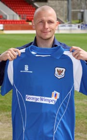 Jody Morris, shows the new 08/09 St. Johnstone home shirt, which sees a return to the traditional blue home shirt. Jody Morris, shows the new 08/09 St. Johnstone home shirt, which sees a return to the traditional blue home shirt.